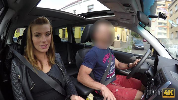 Sensual young gal wears stockings and glasses while bending over the table